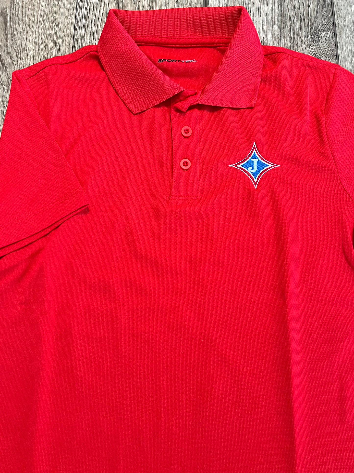 Youth Short Sleeve Moisture Wicking Polo with school logo