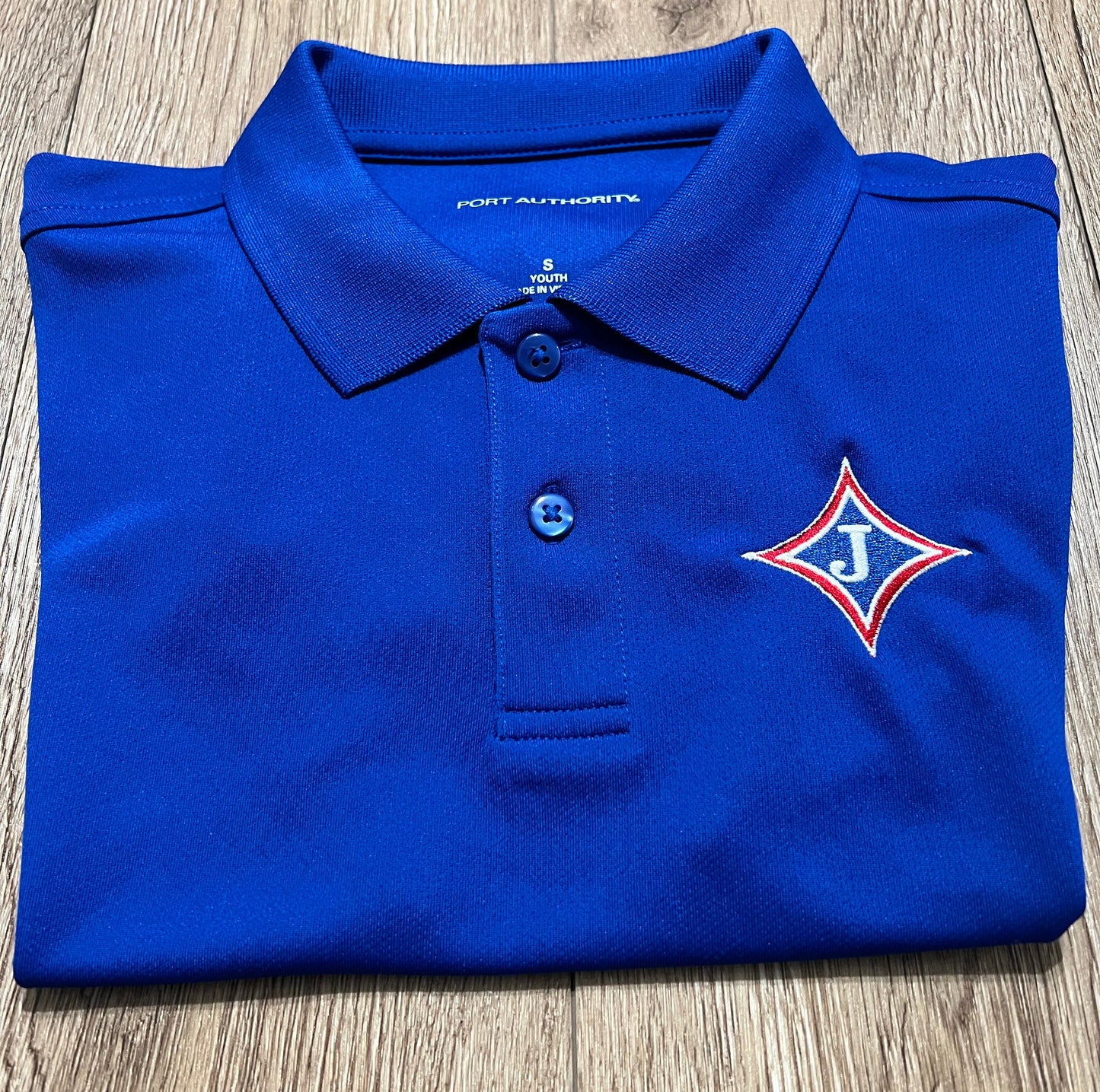 Youth Short Sleeve Moisture Wicking Polo with school logo