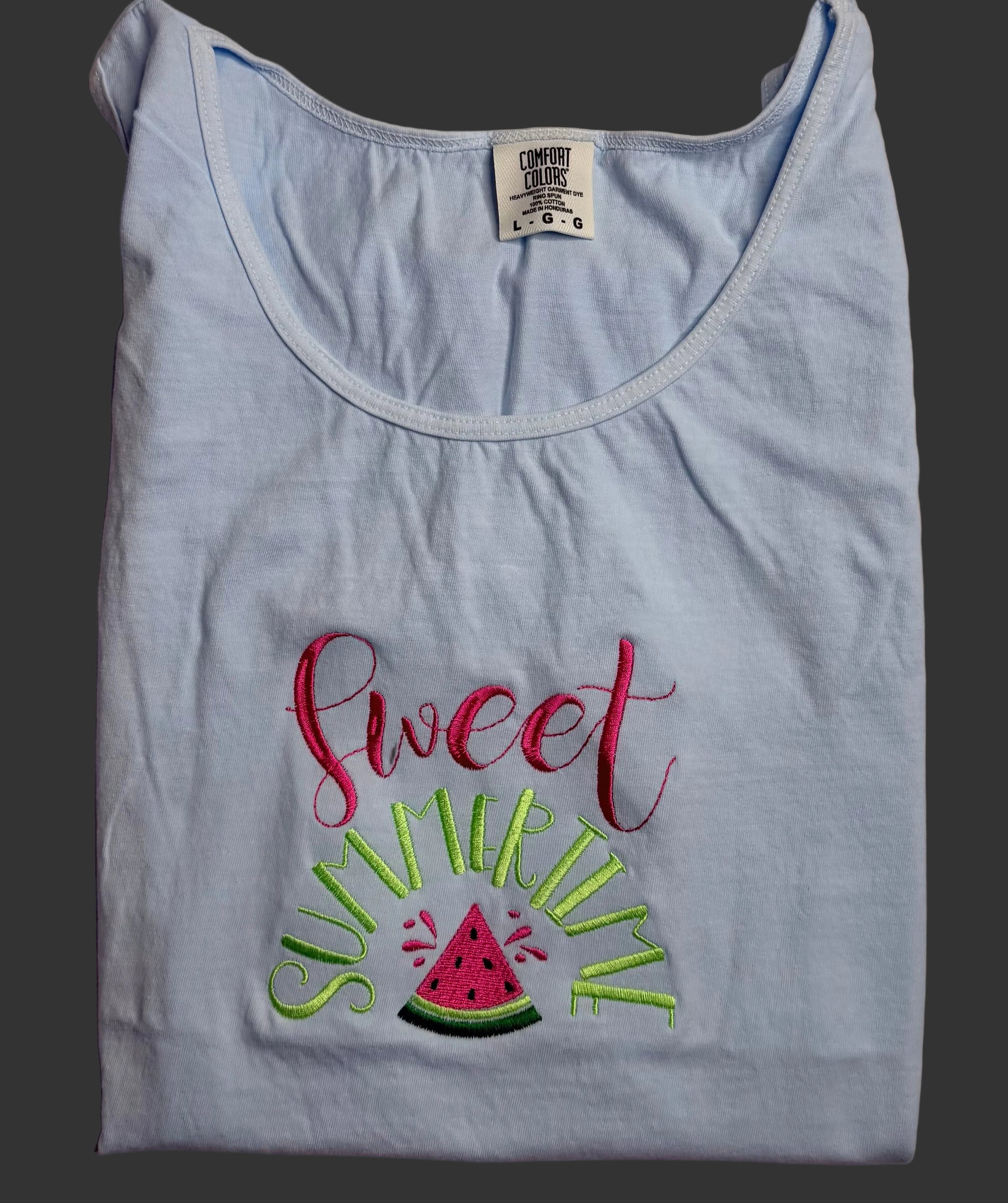 Light blue tank top with 'sweet summer' text and watermelon graphic on a gray background