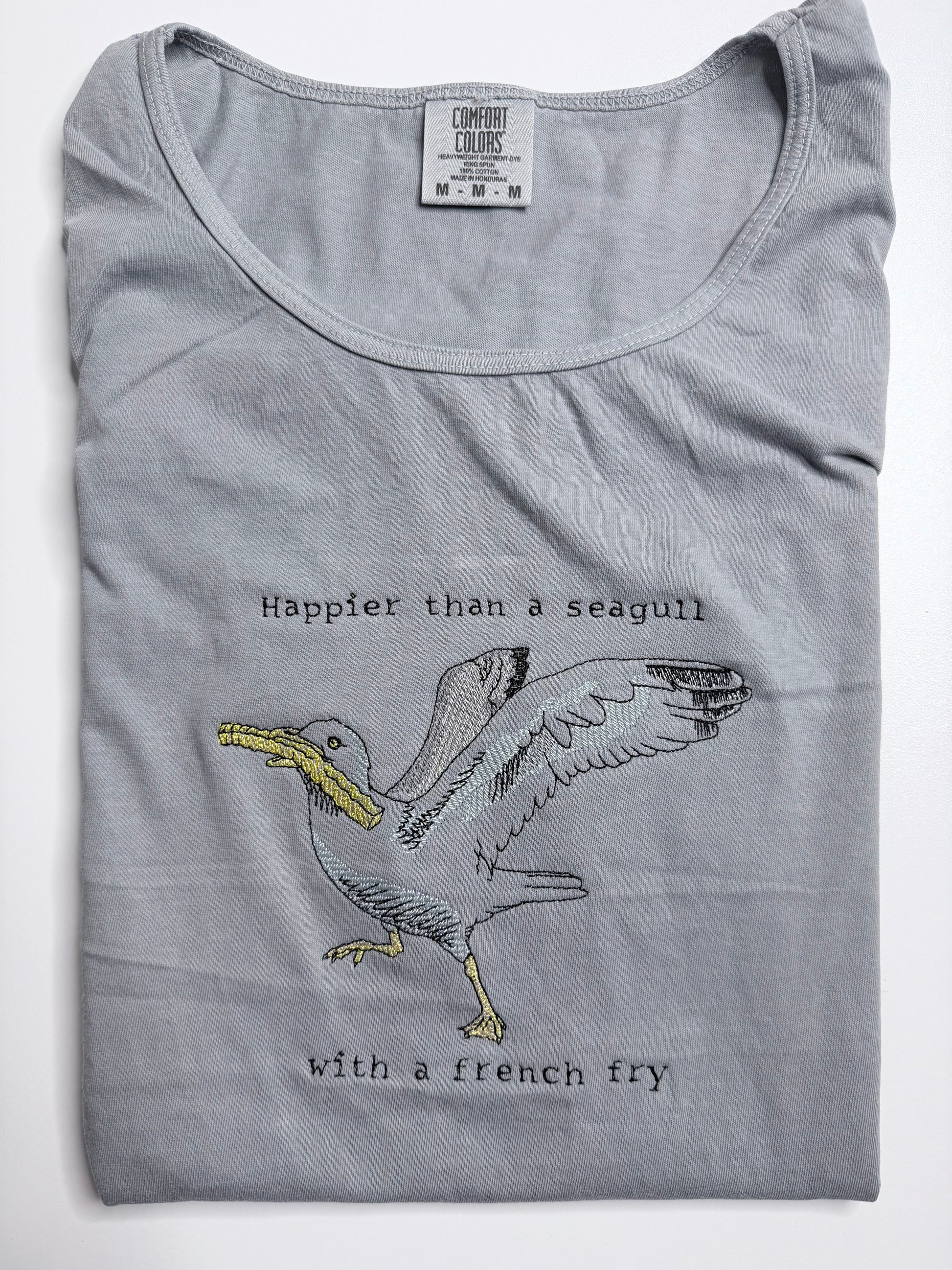 Gray tank top with a seagull graphic and text on a white background