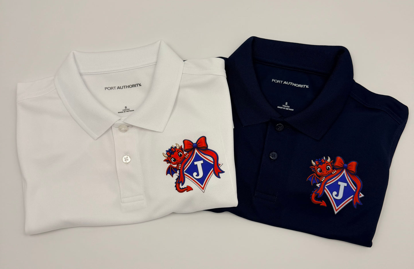 Youth Moisture Wicking Polo with DTF print of Young Girl Dragon with a Bow Logo
