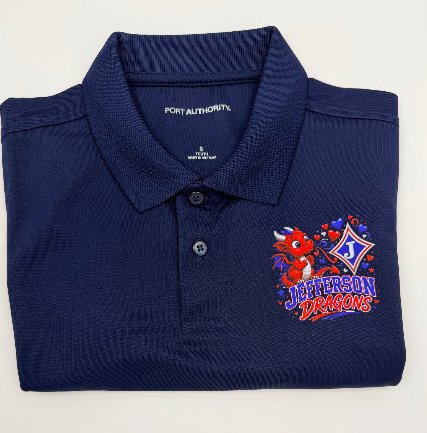 Youth Moisture Wicking Polo with DTF print of cute Dragon Blowing Hearts and the Jefferson Logo