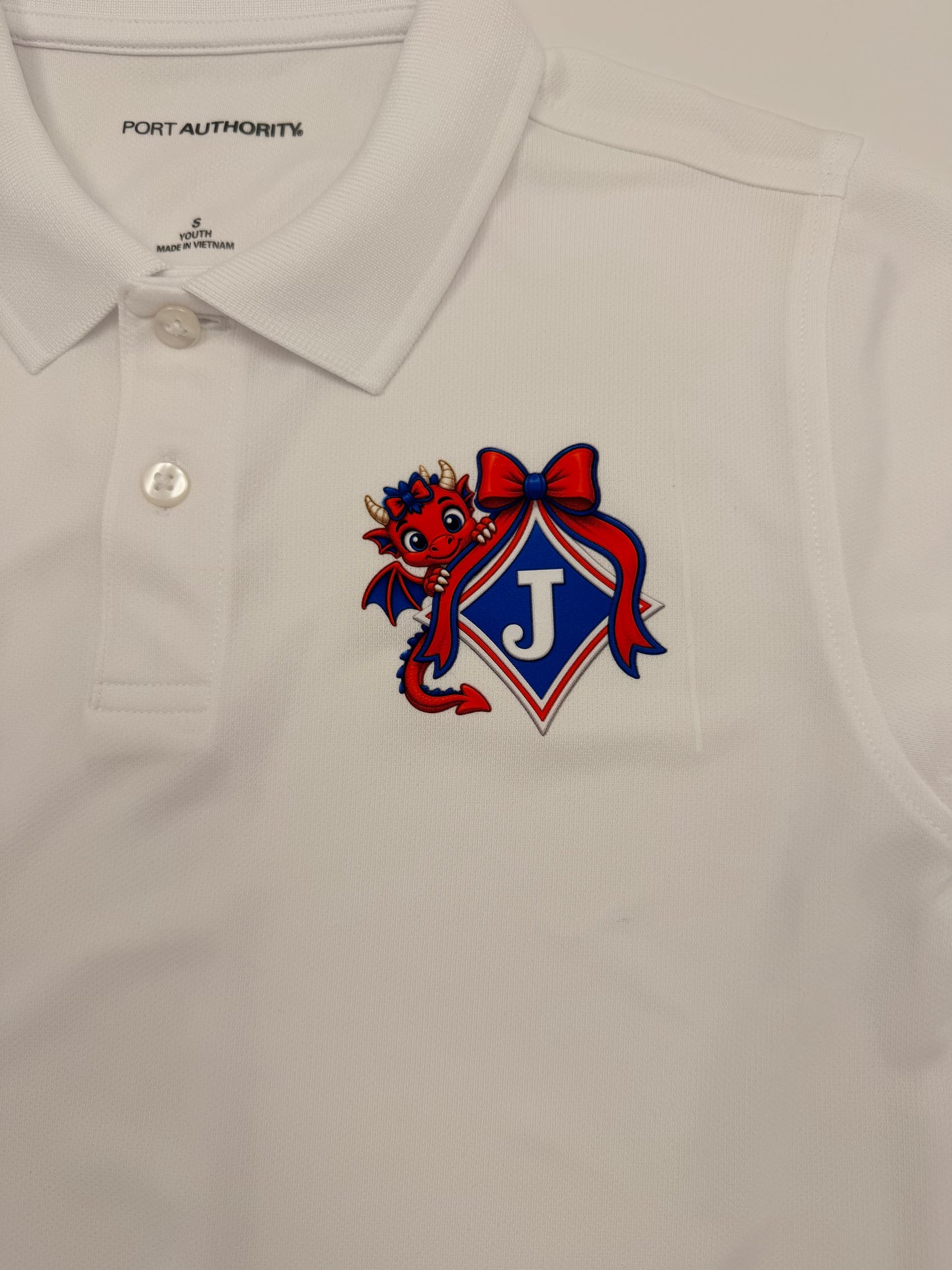 Youth Moisture Wicking Polo with DTF print of Young Girl Dragon with a Bow Logo