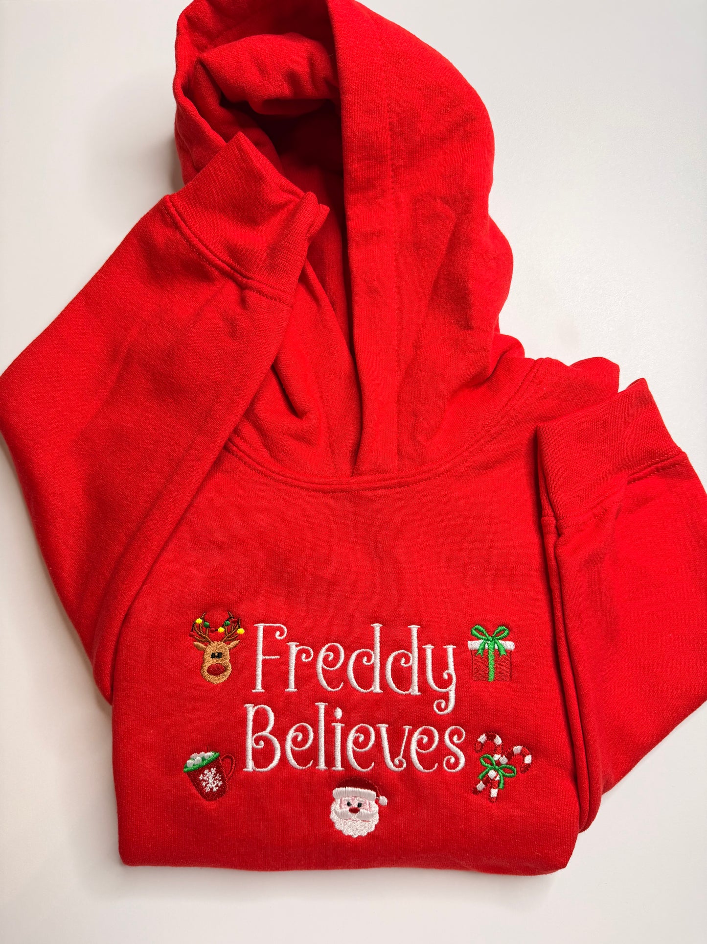 Embroidered Christmas "(Child's Name) Believes" Hooded Sweatshirt