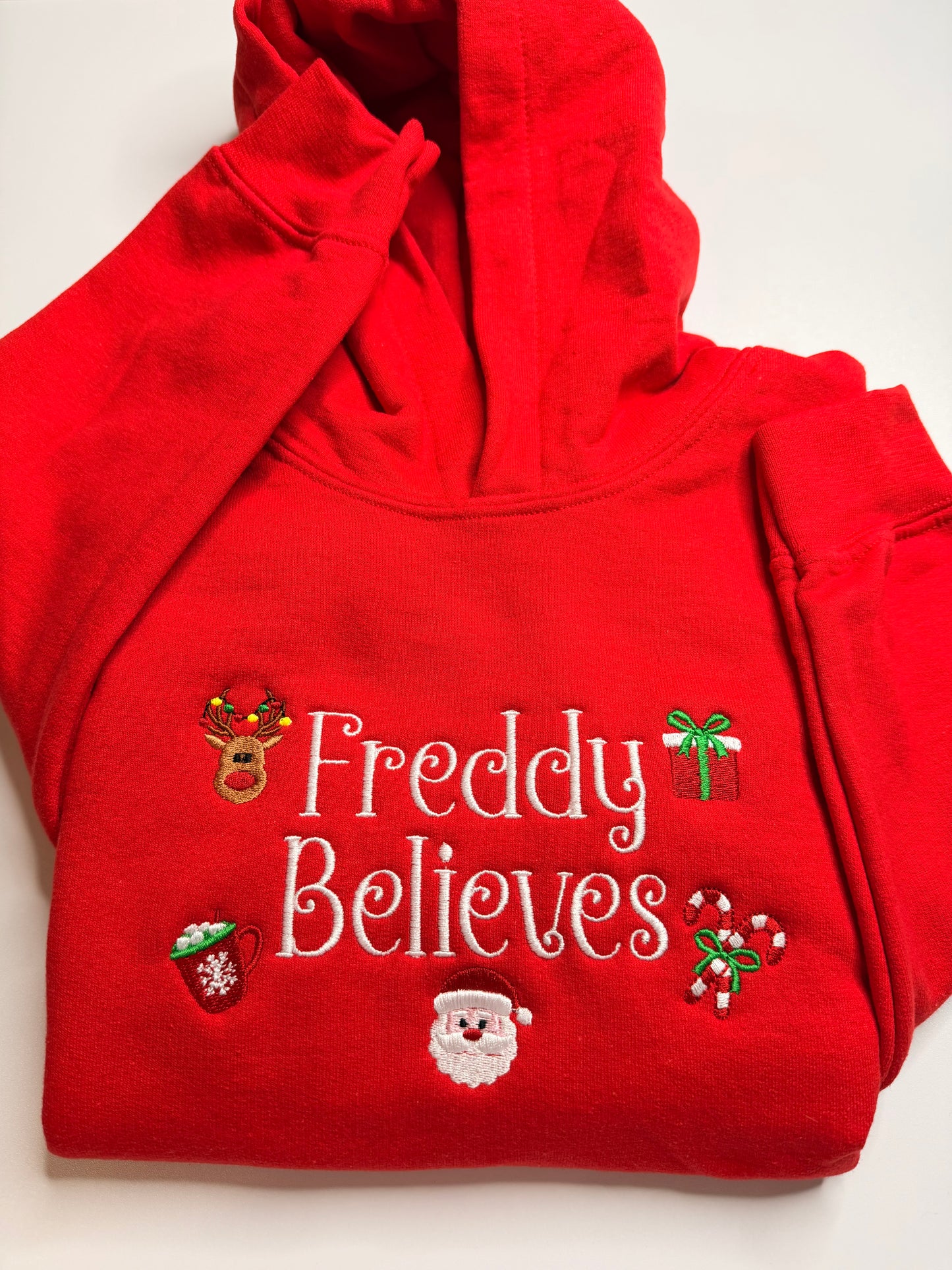Embroidered Christmas "(Child's Name) Believes" Hooded Sweatshirt